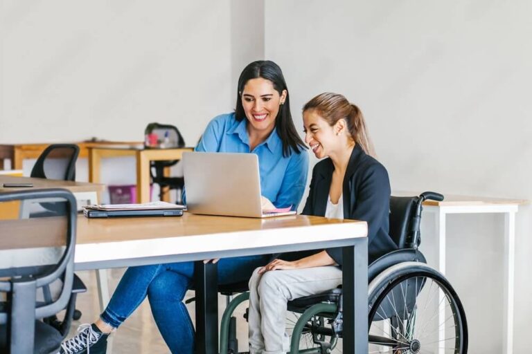 An NDIS participant sorting financial documents with their plan manager