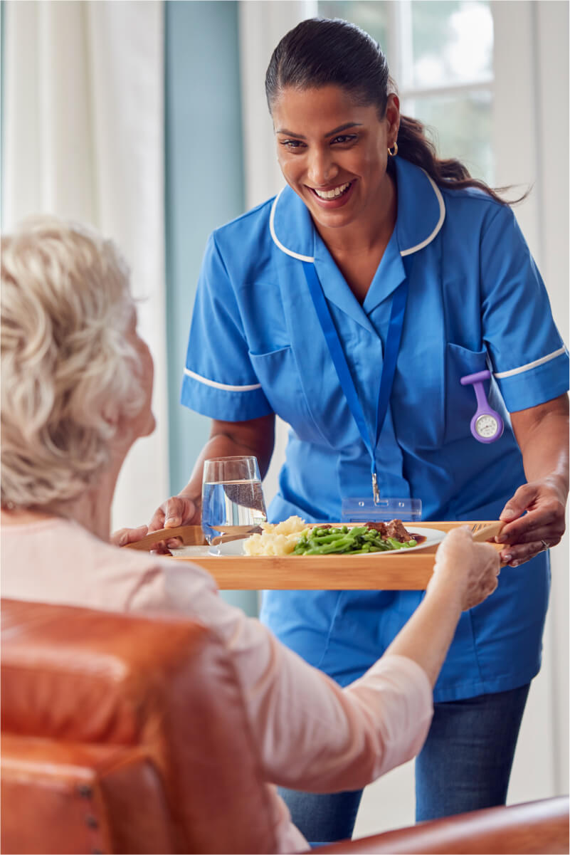 A support worker having a calm, supportive conversation with a participant