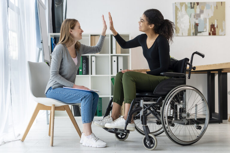 A positive behaviour support practitioner working with a participant